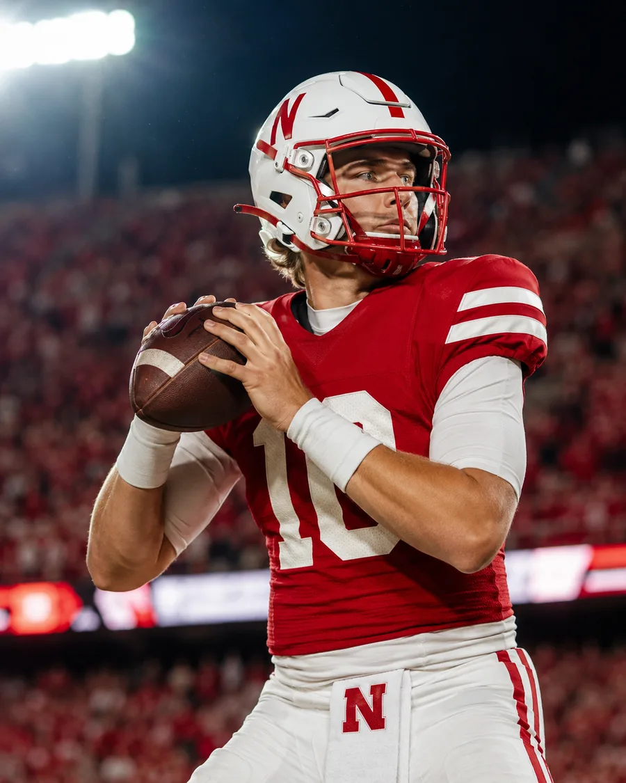Illustration of a Nebraska Cornhuskers quarterback in a scarlet No. 10 home jersey